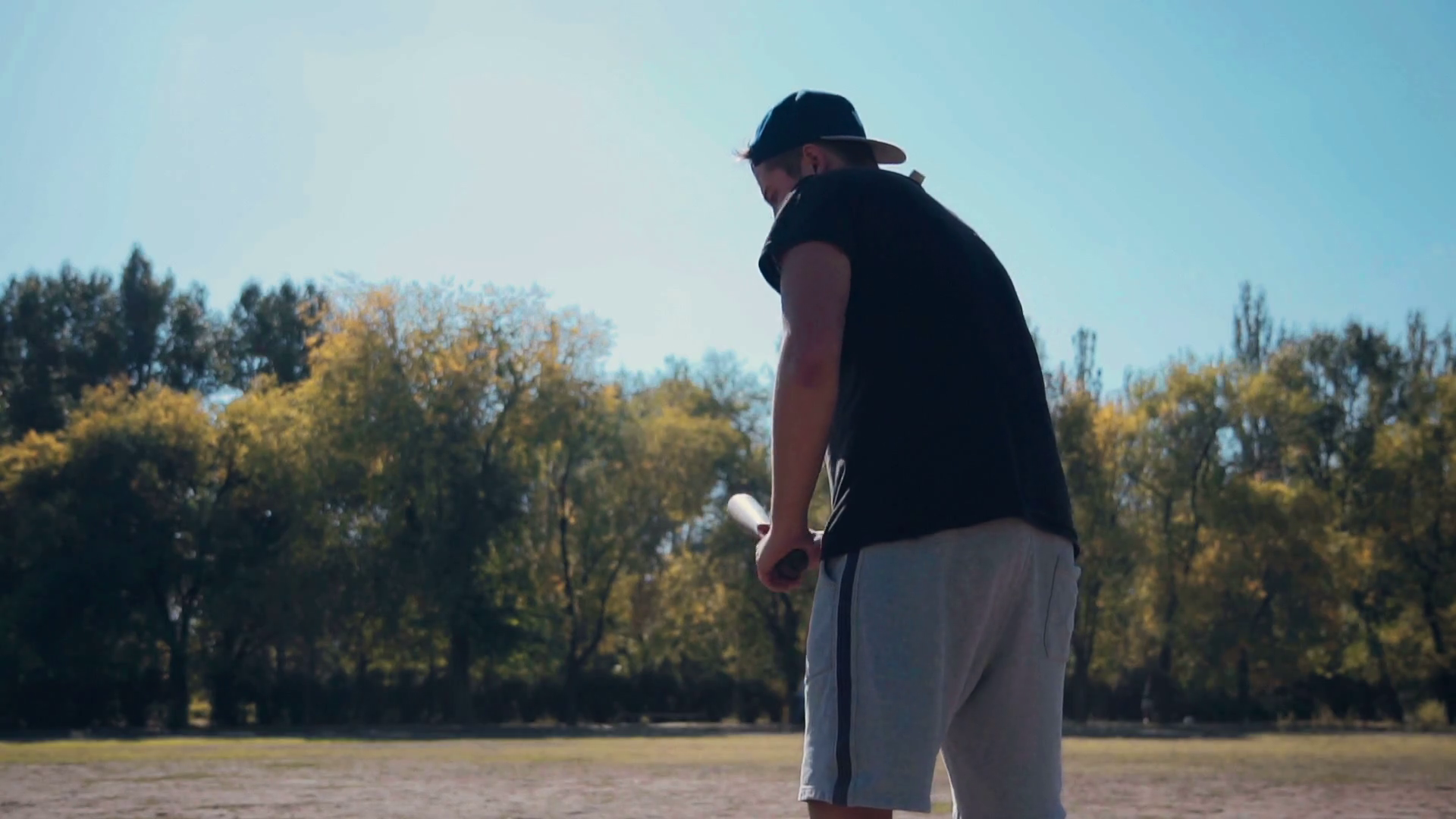 Slowmotion Young Male Batter Standing Ready for Pitch with Baseball Bat