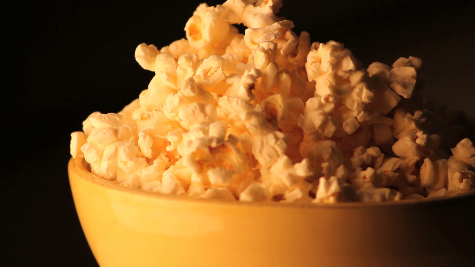 Spinning Bowl Of Popcorn Zoomed Out Stock Footage SBV300027893