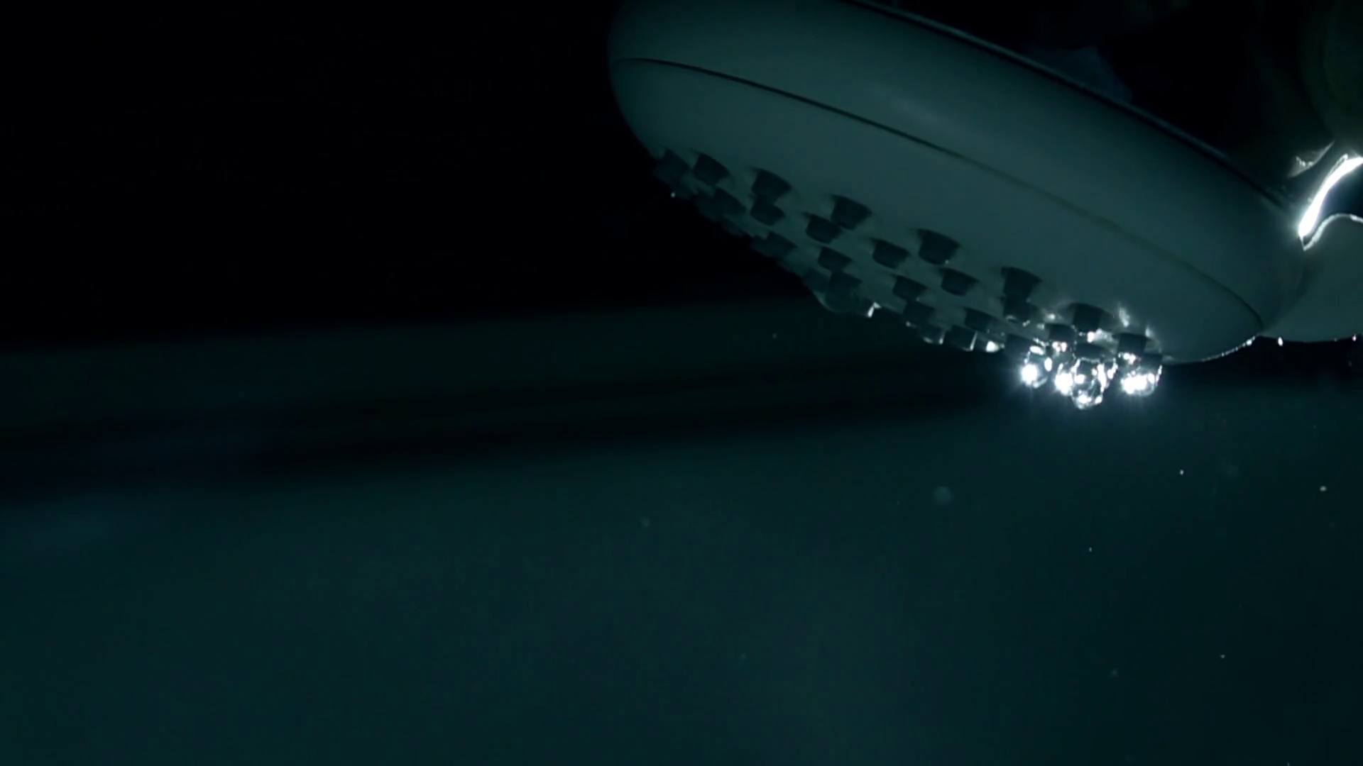 Super slow motion closeup shot of a shower being turned on, 500 fps