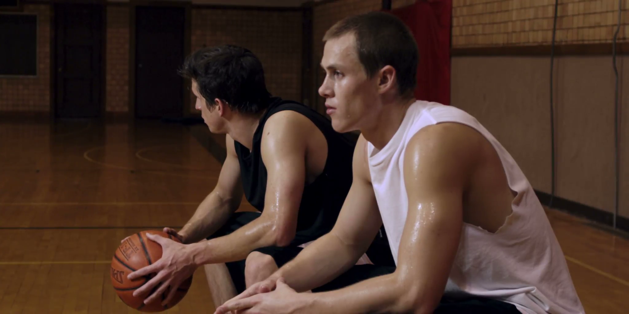 Two Sweaty Basketball Players Sitting Stock Footage SBV300067162
