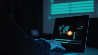 Hands of unrecognizable man typing a laptop in futuristic office