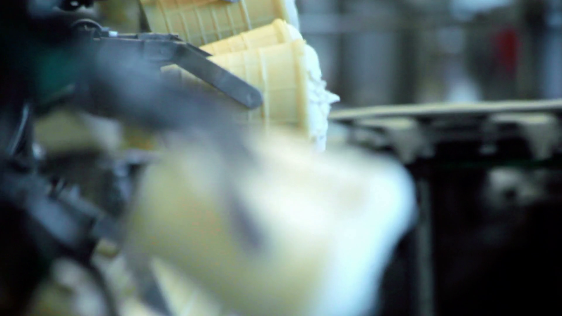Manufacturing line at food factory. Close up of ice cream manufacturing
