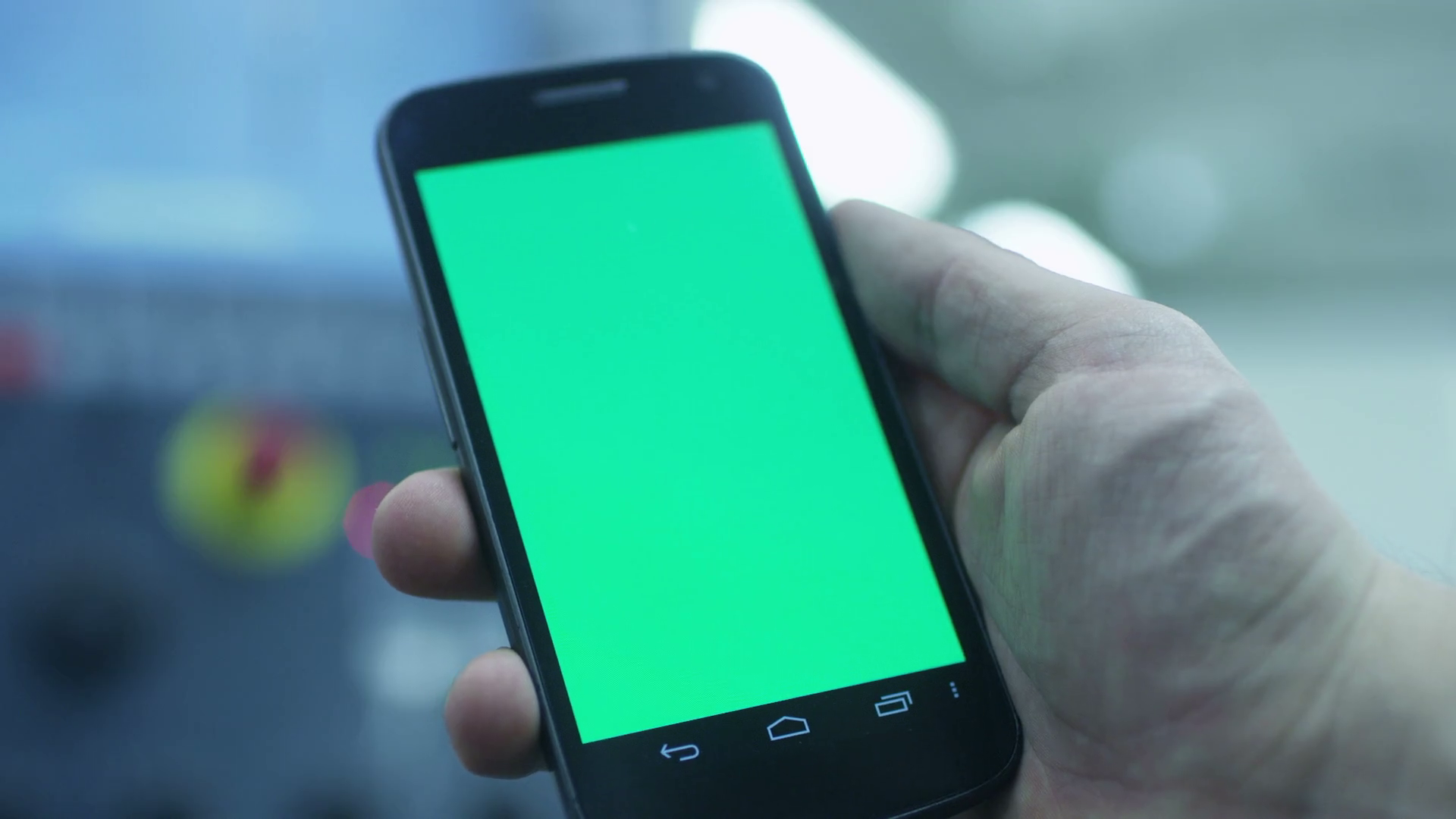 Worker is Using Smartphone With Green Screen in Portrait