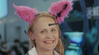 Woman tries on Brainwave Controlled Cat Ears, captures mood with selfie