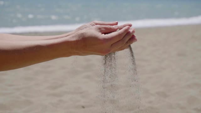 Sand Falling Through Fingers Stock Footage: Royalty-Free Video Clips ...