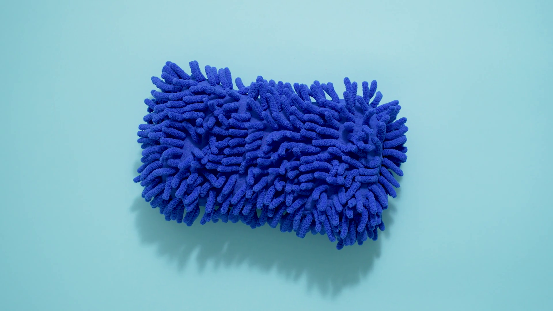 Microfiber mop tip for cleaning and mopping isolated on blue background