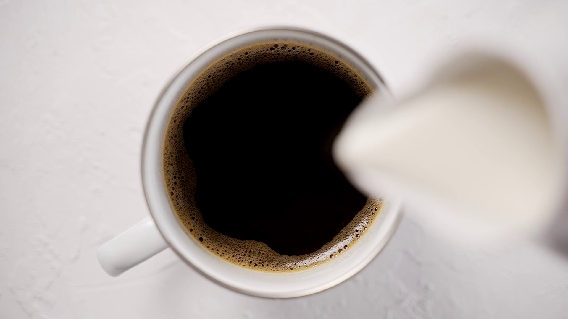 Adding Cream To Cup With Black Hot Coffee Stock Footage SBV346453947