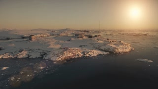 Antarctica Vernadsky base landscape. Aerial drone view flight 4k. Breathtaking panoramic overview Antarctic base among snow covered hills at