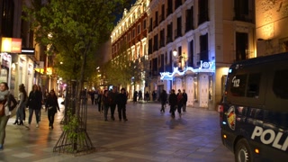 Madrid Spain night Life, Woman makes Photo with Phone and Police Car