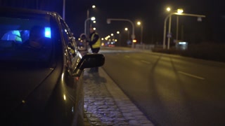 Police stop the Car on a Pursuit on a Road with flashing Lightning