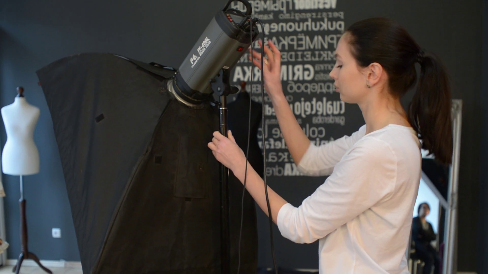 Woman Fashion Photographer works with Flash at the Studio Stock Video