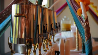 Indian masala chai or tea in kettles. Wide view