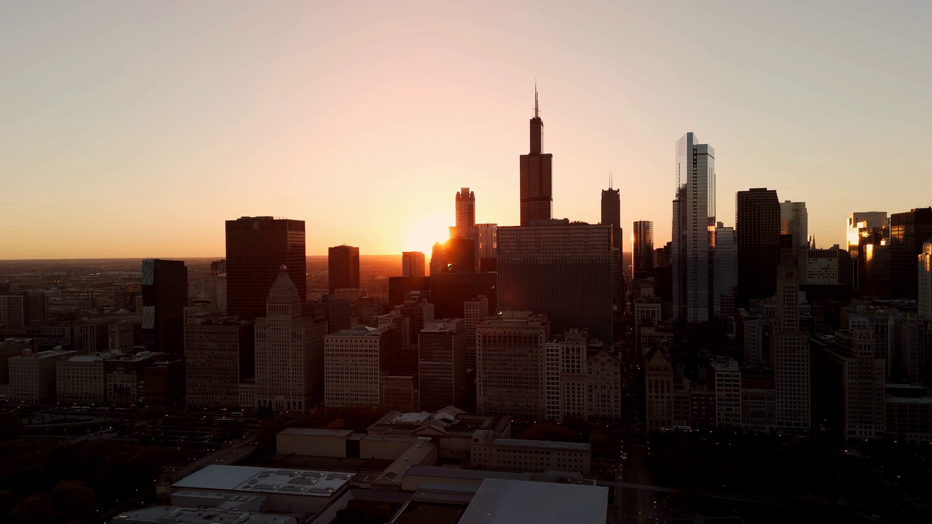 Aerial View Of Chicago Skyline At Sunset Stock Footage SBV-352006004 ...