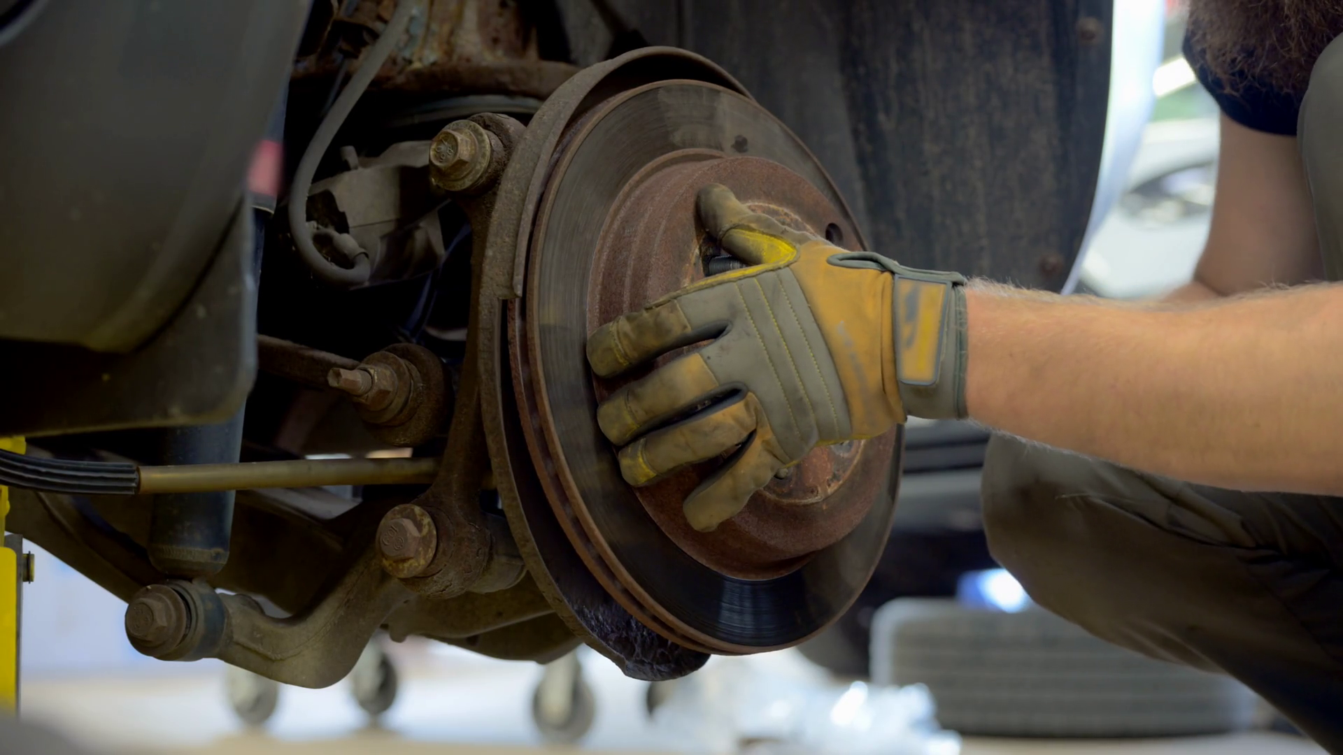 Mechanic Removing Old Brakes Rotors To Stock Footage SBV-352377204 ...