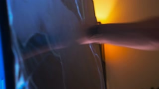 A man smashes an LCD TV with his hands. fit of rage. Slow motion footage