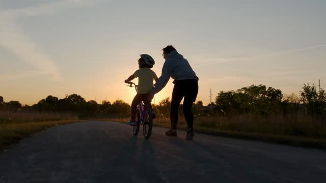 Little Girl Ride Biker Sunset Meadow Away Stock Footage: Royalty-Free ...