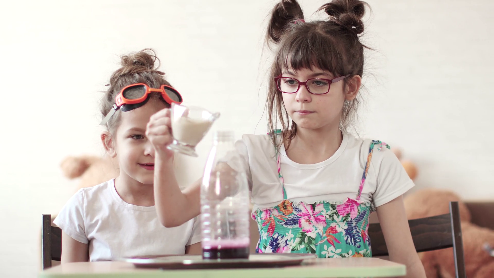entertaining science. children conduct a scientific experiment at home