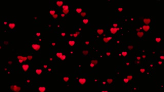 Red hearts floating upwards on a black background for valentine's day