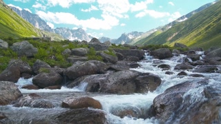 Clear waters of a high altitude stream in the Caucasus at the foot of Mount Elbrus