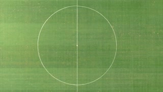 Aerial view of the starting point and circular ring in the soccer football pitch center
