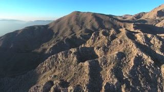Aerial view of treeless stony and rocky bare mountain slopes