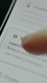 Interactive text urging users to learn more about Trading
