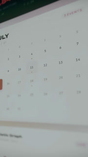 Modern calendar UI with a grid layout, user tapping on the date 11