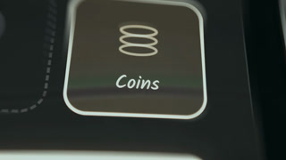 Digital button labeled Coins with stacked coins icon