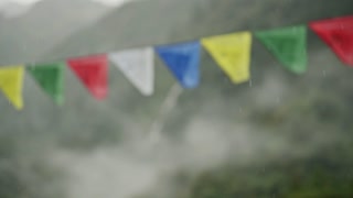 Raining on Buddhist Prayer Flags in Rain in Nepal in the Himalyas Mountains, Close Up in Rainy Season of Heavy Rain and Tibetan Prayer