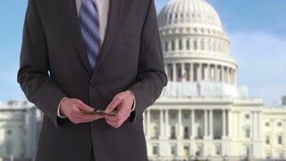 Politician with money in front of US Capitol building