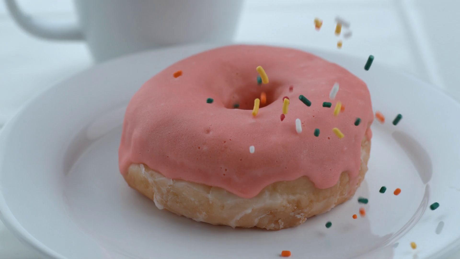 Sprinkles Falling Onto Donut In Slow Motion; Stock Footage SBV