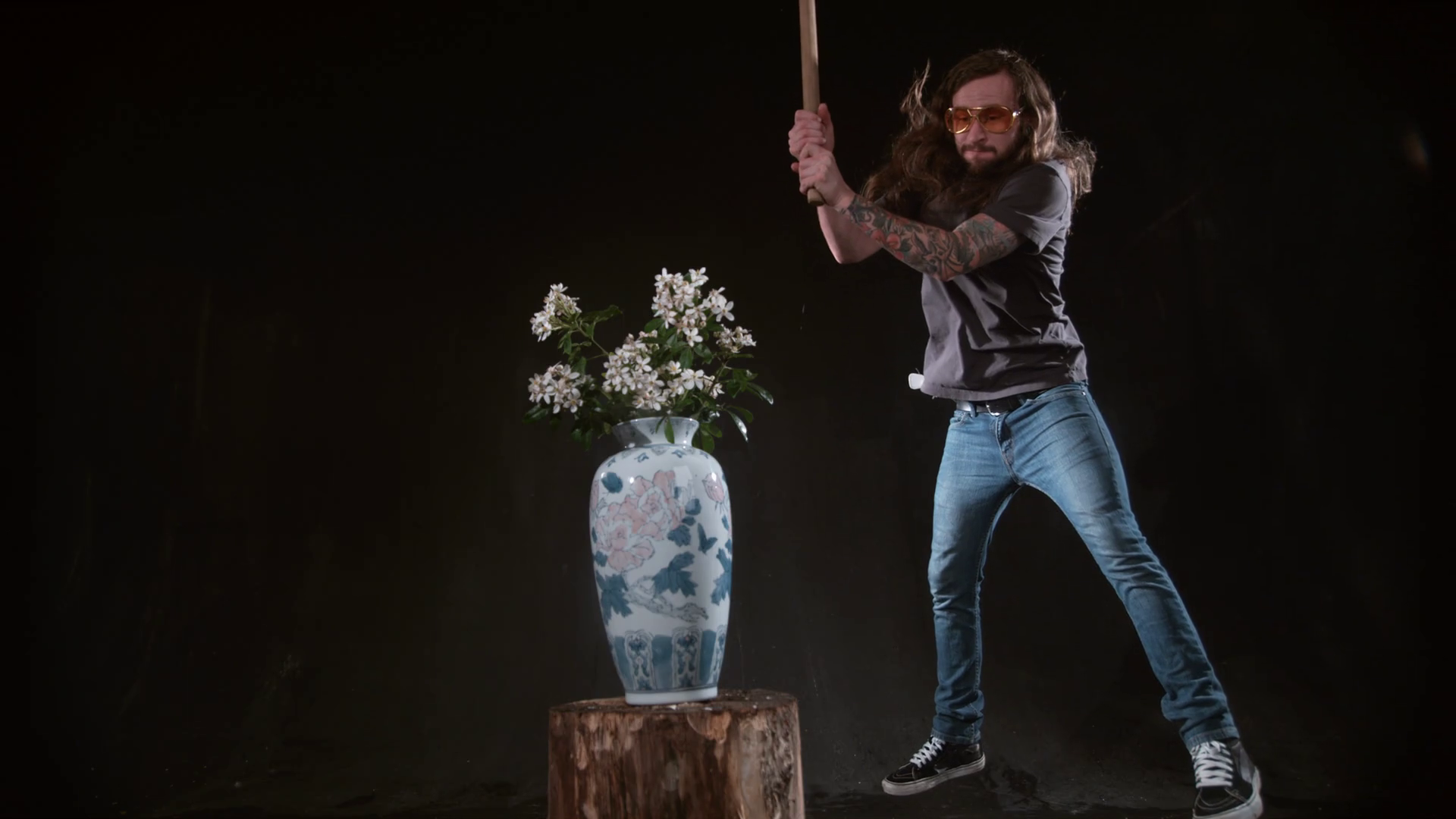 Man Smashing Vase Of Flowers With Hammer In Stock Footage SBV347610847