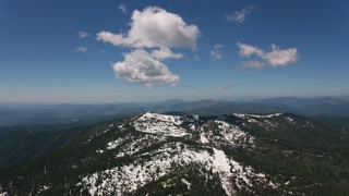 Cascade Mountains, circa-2019.  Aerial view of cloud and wilderness.  Shot from helicopter with Cineflex gimbal and RED 8K camera.
