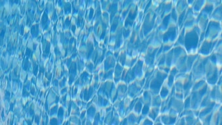 Pool water close-up texture. Vertical video.