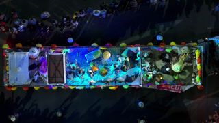 Aerial View of Decorated Parade Float with Musicians During Night Festival.