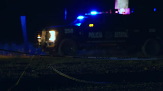 State Police Truck with Flashing Emergency Lights at Night Crime Scene.