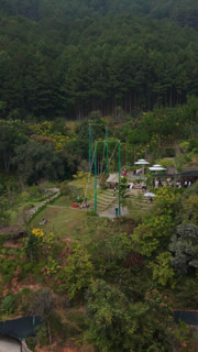 Vertical screen, Vietnam, Da Lat Pavilion Terrace Dalat Forest Cafe With Asian Tourists, Tables And Umbrellas On Hillside Platform, Social