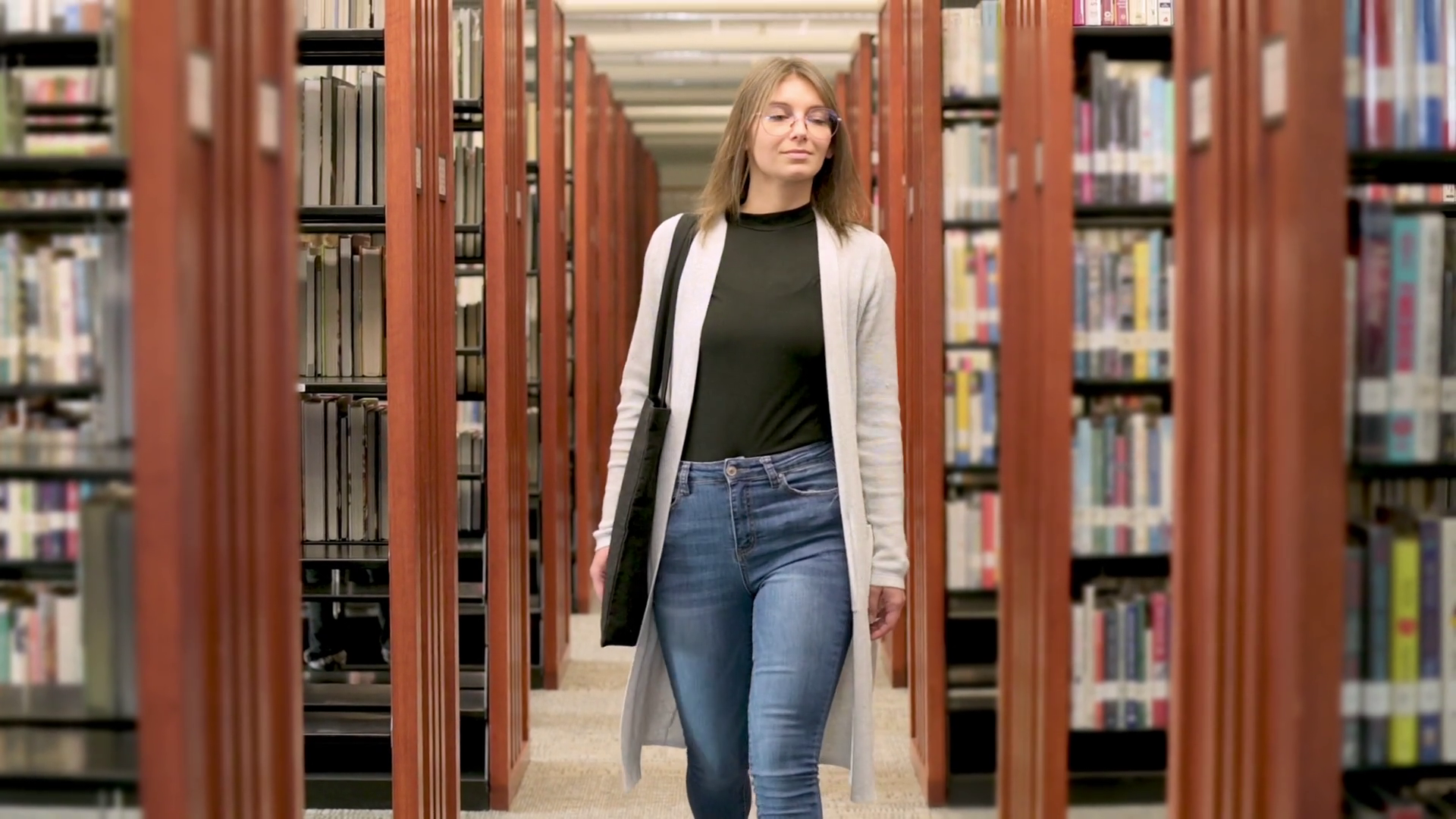 Young Woman Walking Through Library Book Stock Footage SBV-352008319 ...