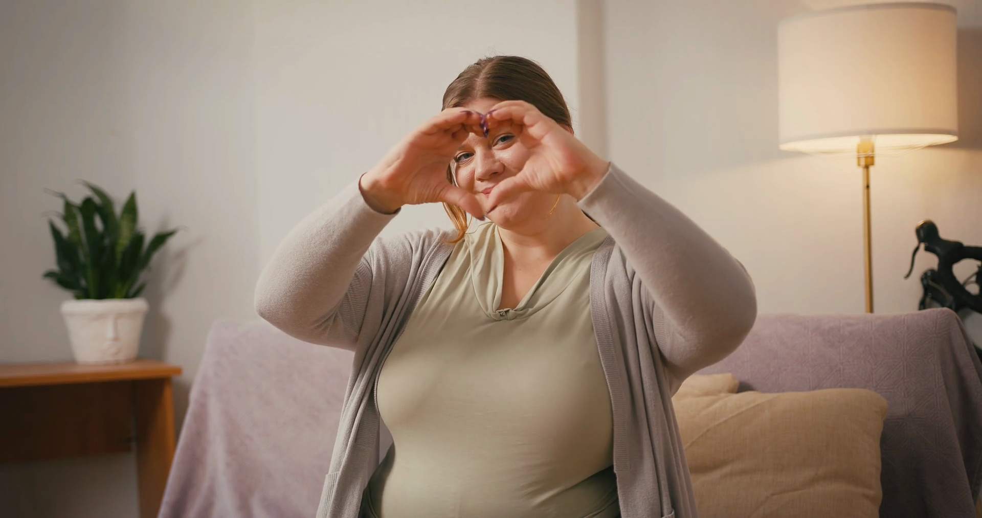 Plus Size Woman Waves At Camera Making Heart Stock Footage SBV ...