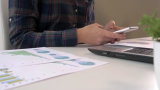 Young professional working in office using technology