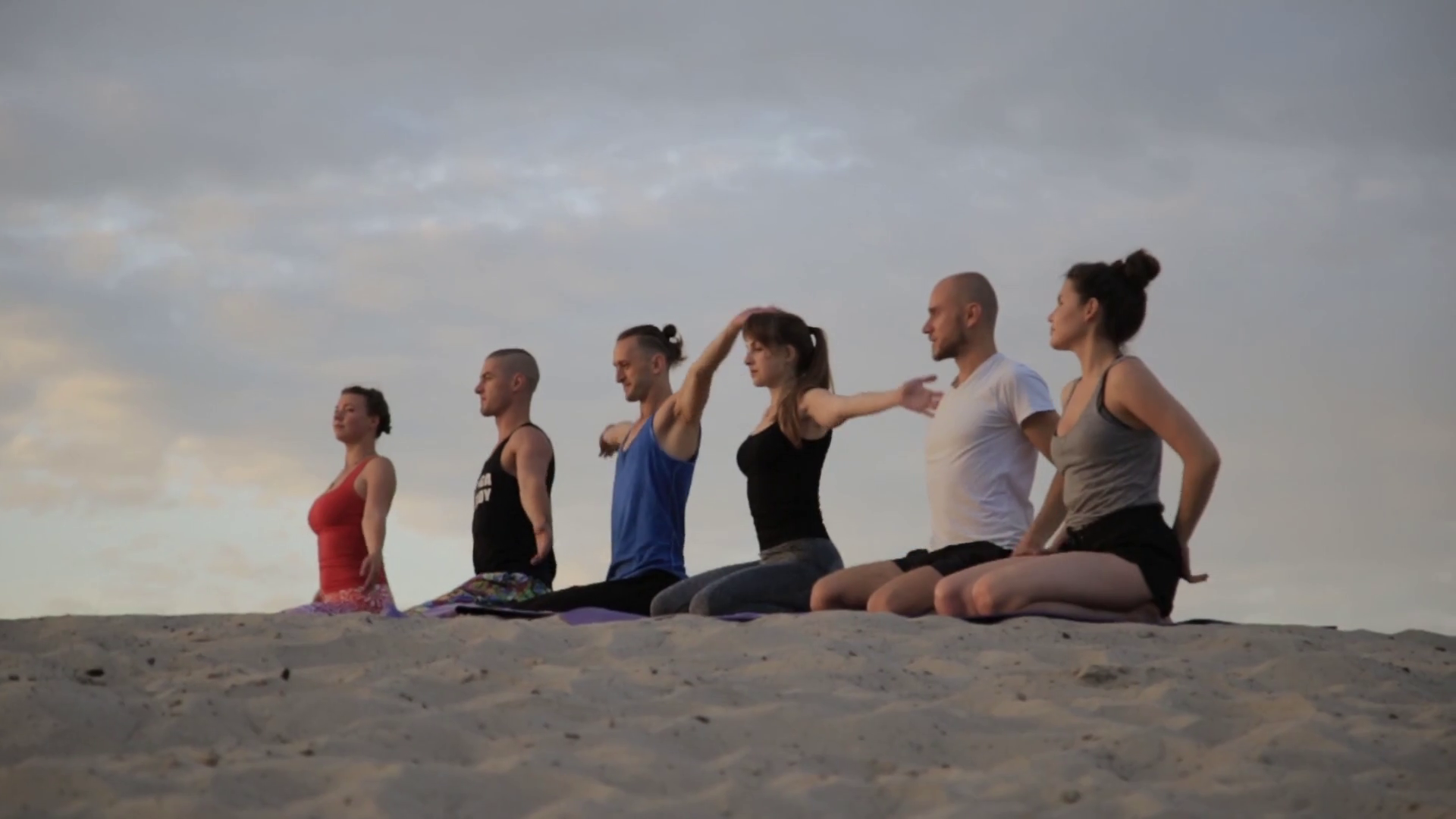 Mixed race group of people exercising yoga healthy lifestyle fitness