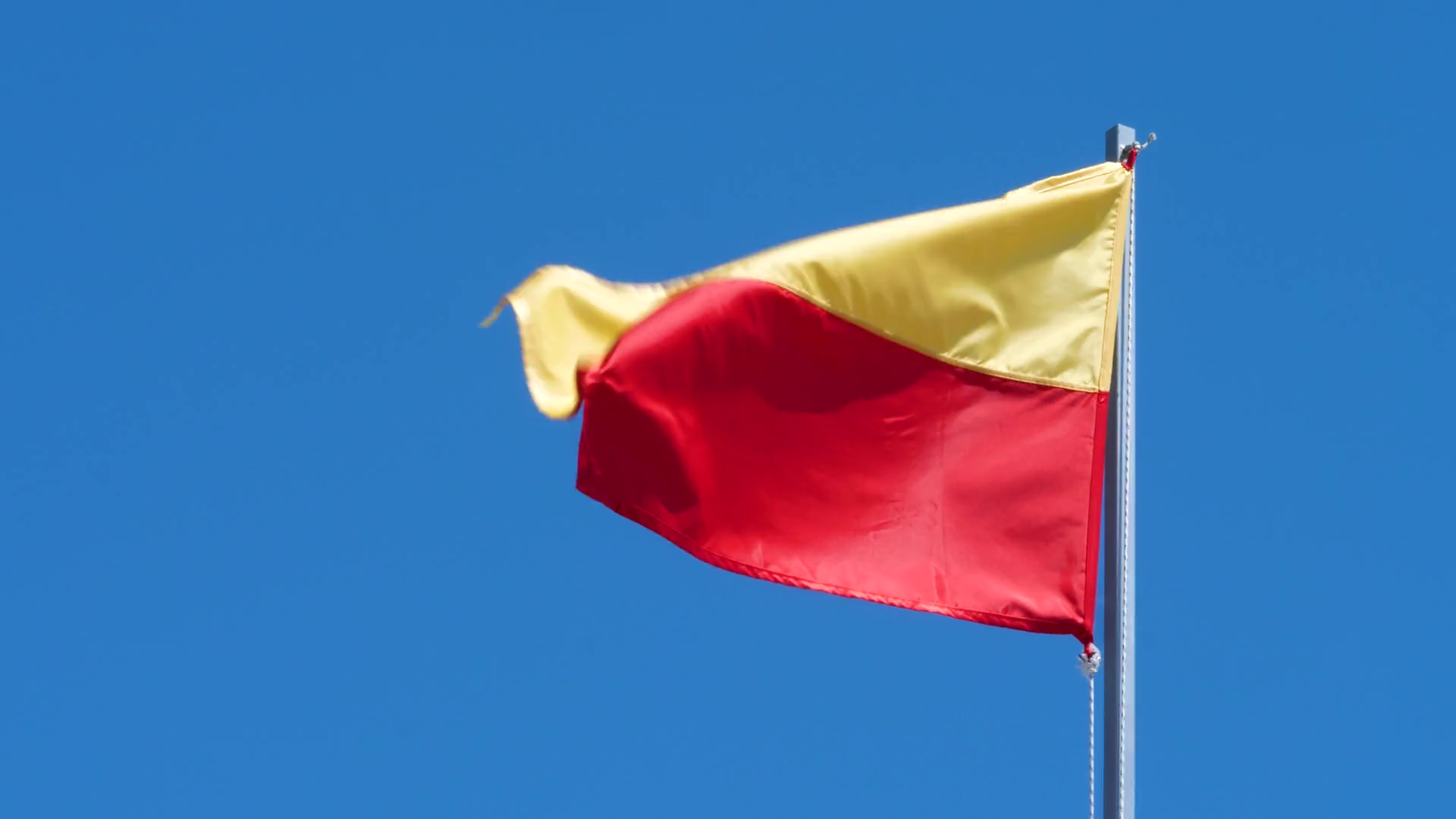 Yellow Red Flag Wave In Wind On Blue Sky Stock Footage SBV346813368