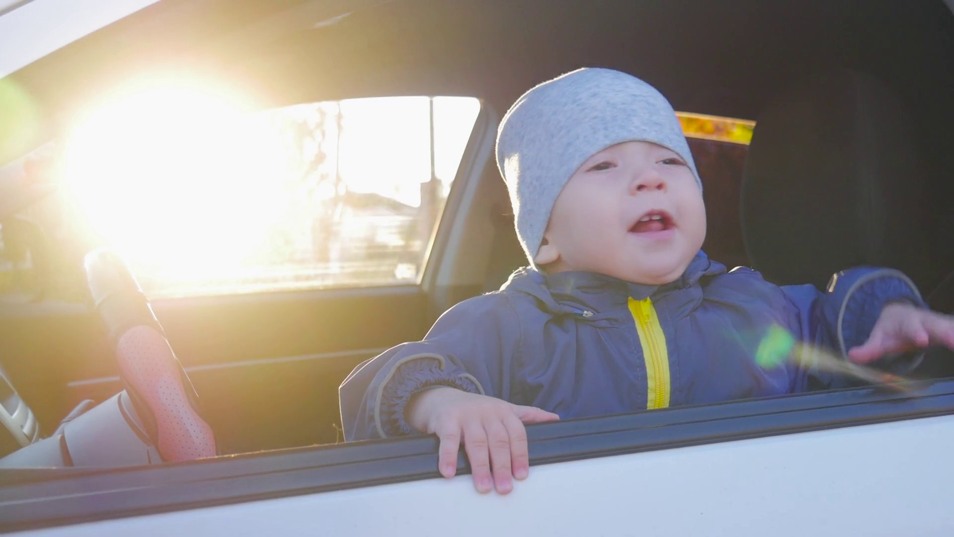 A little baby driving car. Stock Video Footage Storyblocks