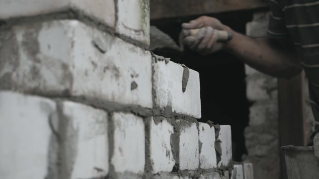 Construction Worker Or Mason Laying Bricks And Creating Walls ...