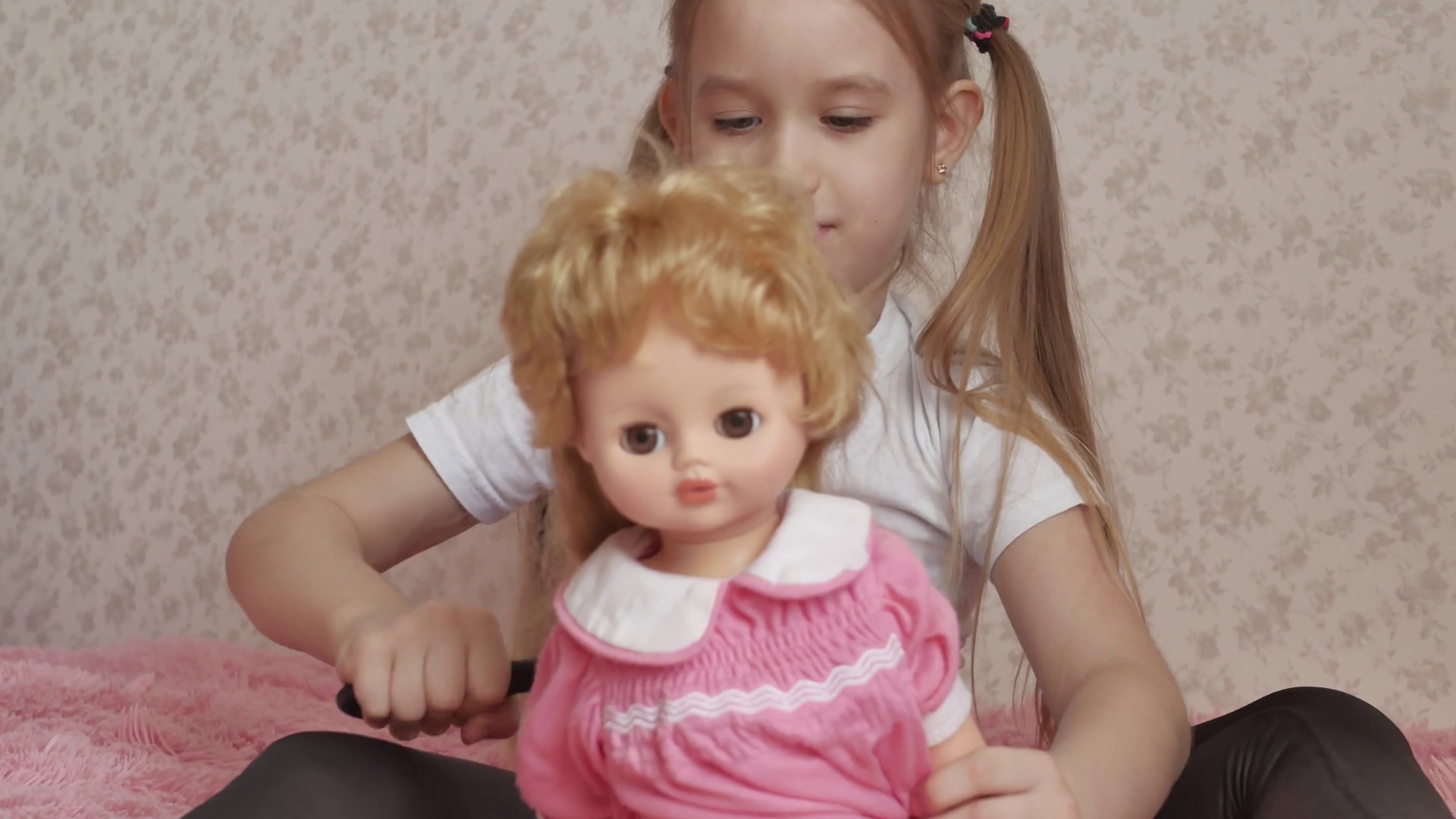 Girl combs doll hair by hairbrush Stock Video Footage 0022 SBV