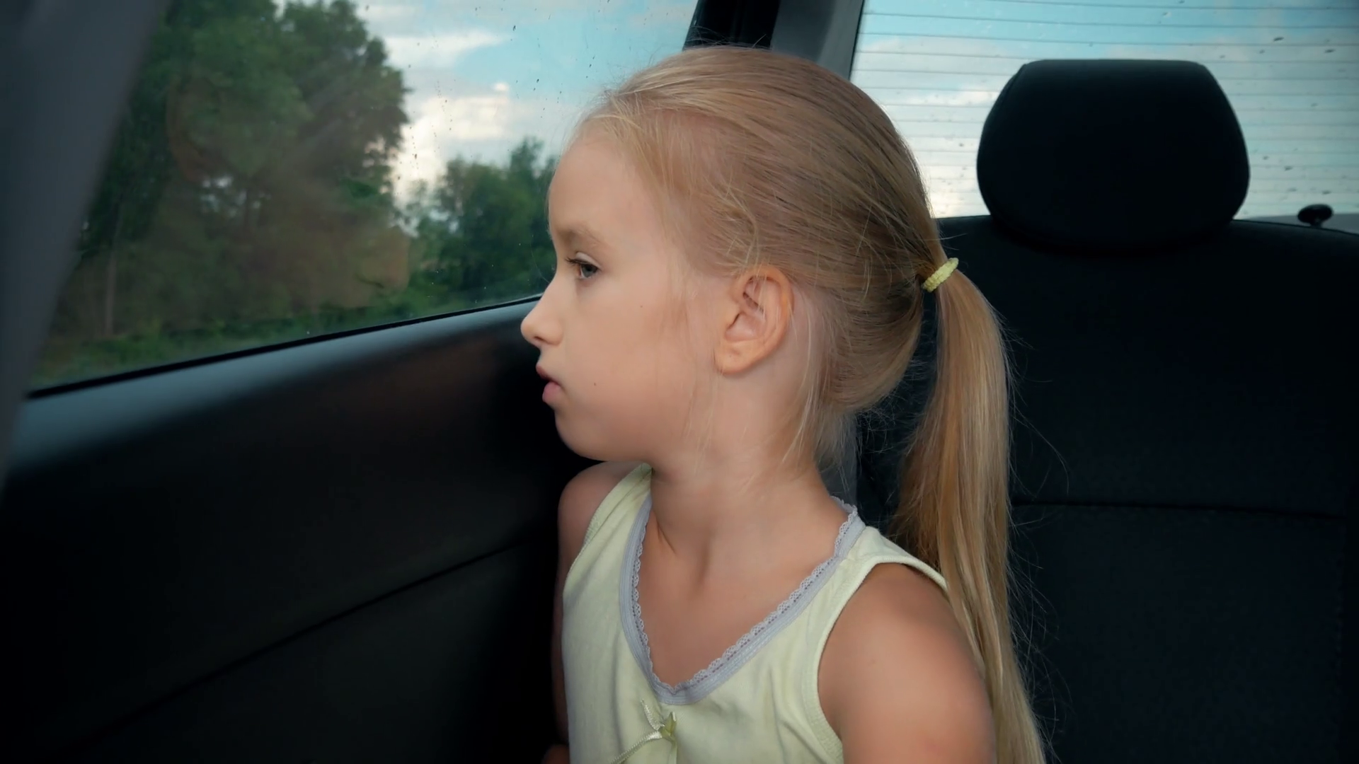 Little Girl Bored In Car Looking Out Window Stock Footage SBV325891095