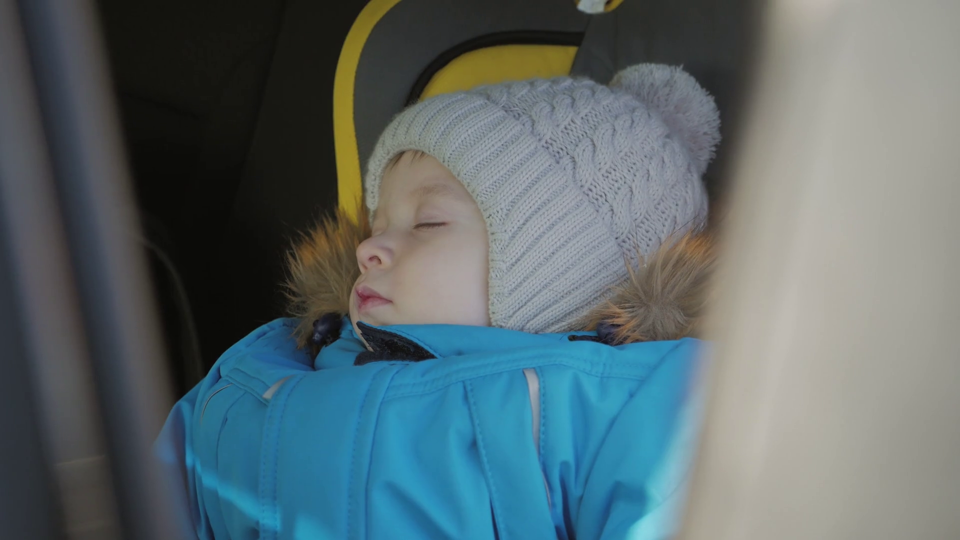 Toddler boy sleeping in child safety seat in car. Stock Video Footage 0017 SBV332340089