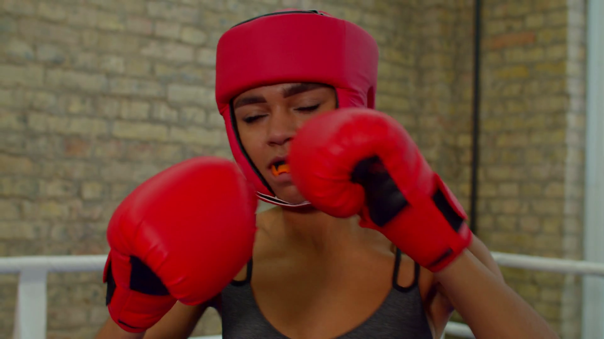 Portrait of determined focused athletic black female fighter with
