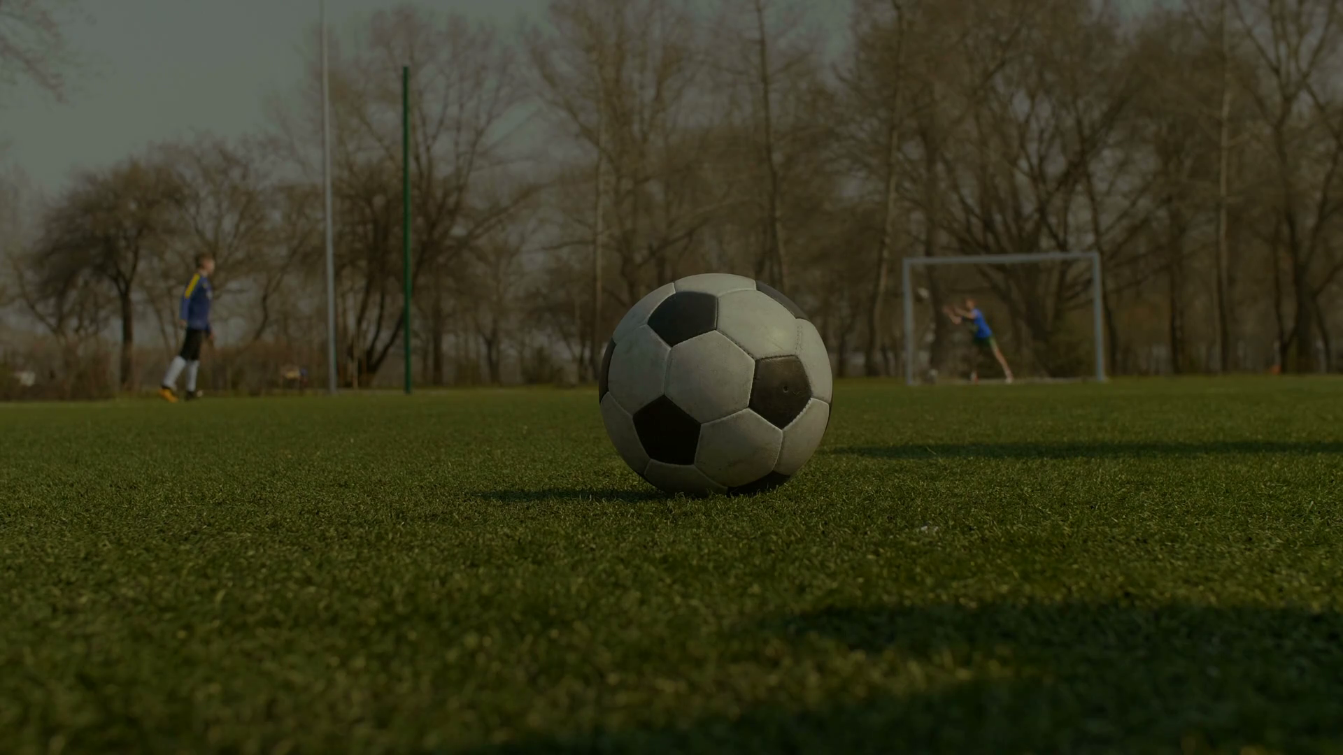 Closeup Of Soccer Player S Foot Kicking Ball Low Section Young Footballer Preparing For Free Kick And Hitting Soccer Ball With His Foot Over Teammates Doing Football Training Session Background Stock Video Footage