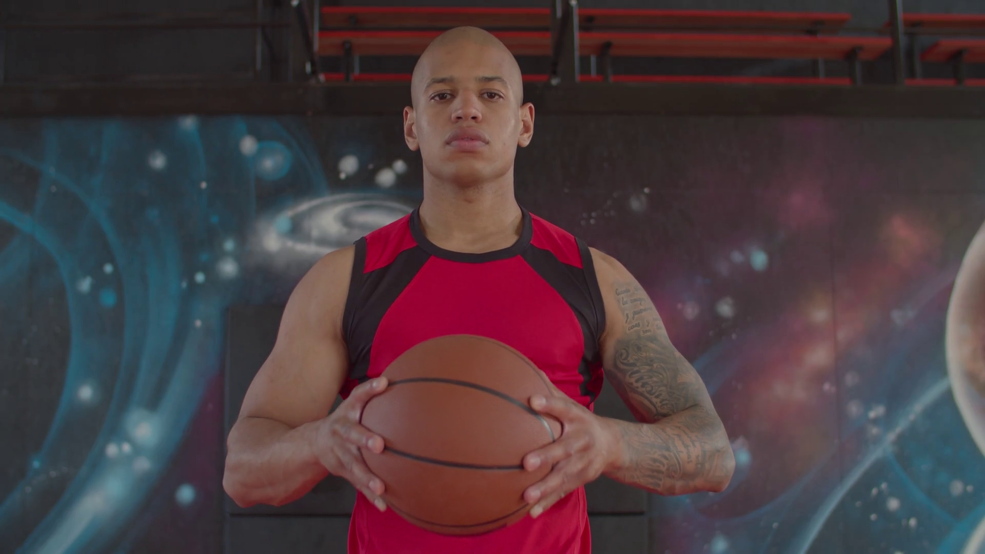 Portrait of concentrated athletic bald african american basketball